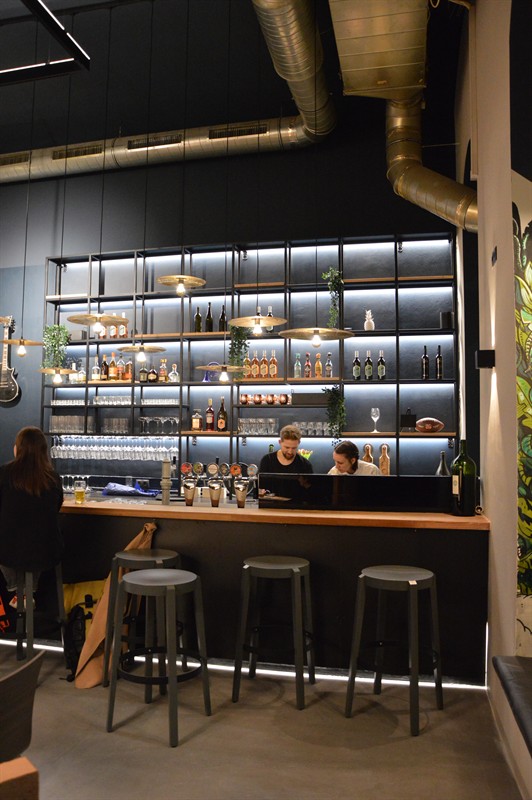 A corner of the bar with stools
