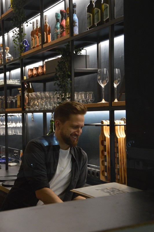 Our bartender laughing at the counter