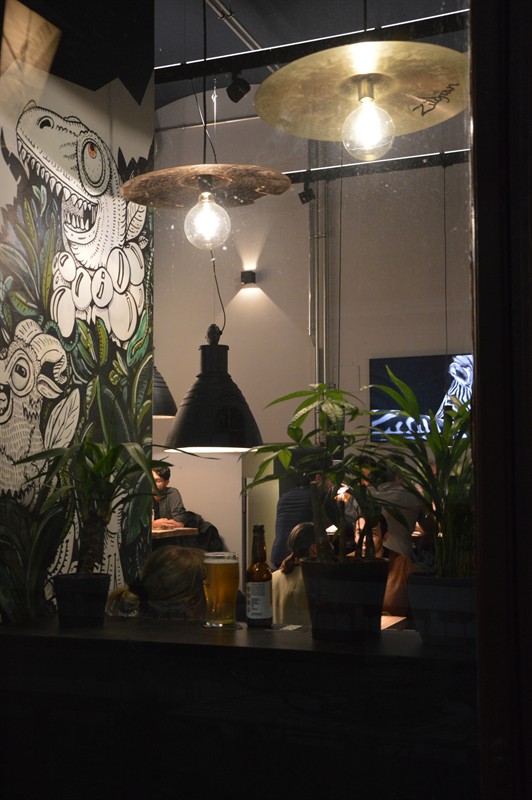 The plant corner with mural and cymbal lamp