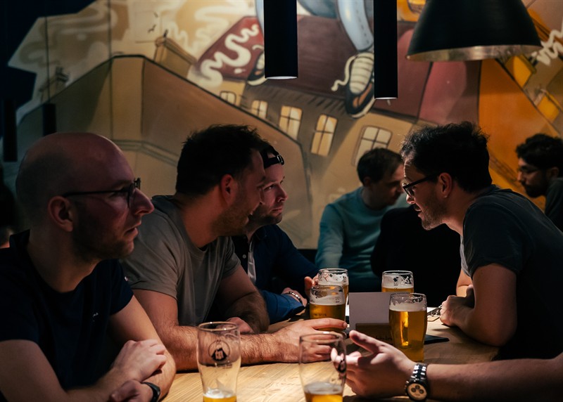 Friends sharing a round at the table
