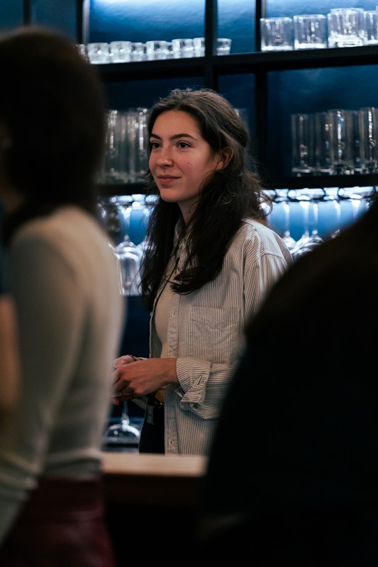 A guest chatting at the bar