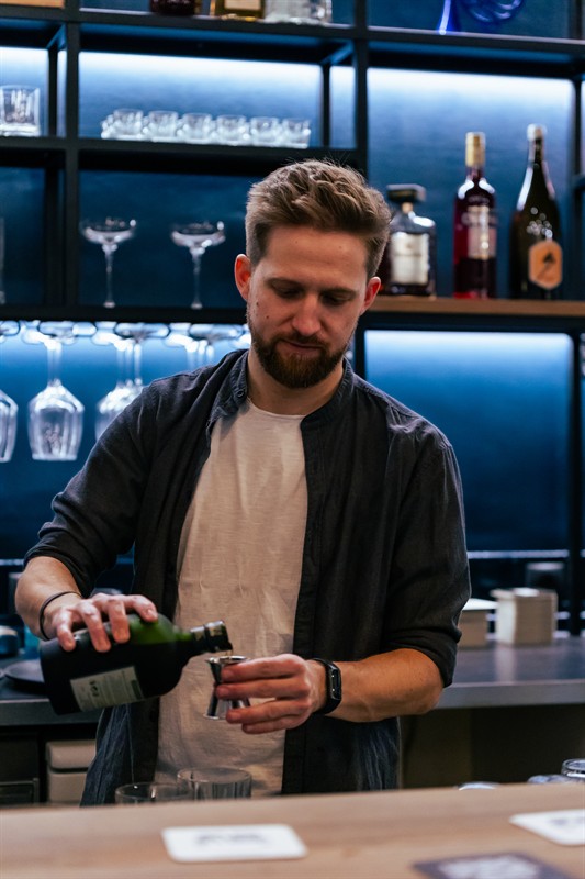Our bartender pouring a drink